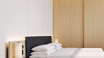 A modern bedroom with a bed, bedside tables, and a nightstand.