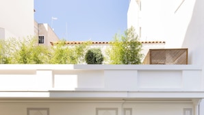 A white building with multiple windows and balconies. - Silk n Cotton (Athens)