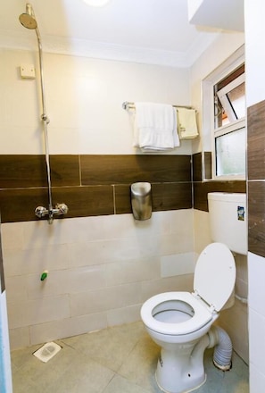 Superior Double Room | Bathroom | Shower, slippers, towels, soap - Coyote Haven Bridge Hotel (Nairobi)