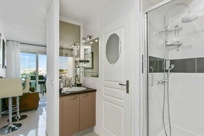 Shower, hair dryer, towels, soap