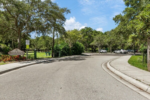 A curved road with a sign for North Water Tower Park.