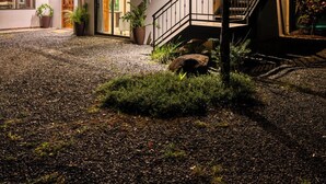 A two-story building with a balcony, a staircase, and a gravel driveway. - Bonita Apt. Amazing 2nd floor Apt - Views Galore! (Tilarán)