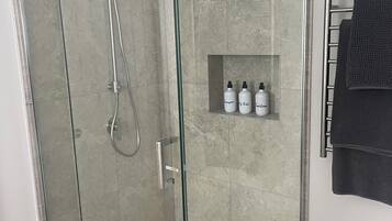 Shower, hair dryer, towels, soap