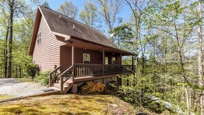 A cabin with a porch, a staircase, and a satellite dish. - 4 Bedroom 3 Bath on secluded acreage with Fireplace & Wifi (Townsend)