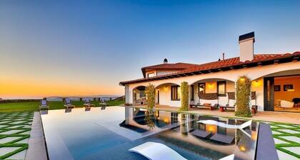 Luxurious 8-bedroom malibu Skyview estate With endless Stunning mountain views.