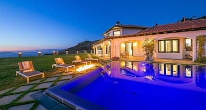 Luxurious 8-bedroom malibu Skyview estate With endless Stunning mountain views.