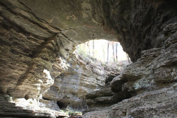 A natural rock formation with a cave-like opening.