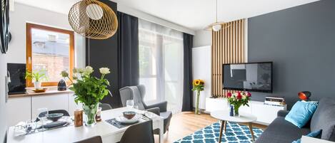 Luxury Suite, Balcony, City View | Living area | Flat-screen TV