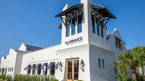 A white building with a sign reading "MIMMOS Ristorante Italiano." - The Village #611 by Southern Vacation Rentals (Santa Rosa Beach)
