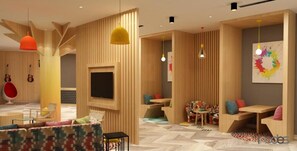 A modern interior with a TV, wooden partitions, and colorful cushions. - Ginger Kochi, Kalamassery (Kanayannur)