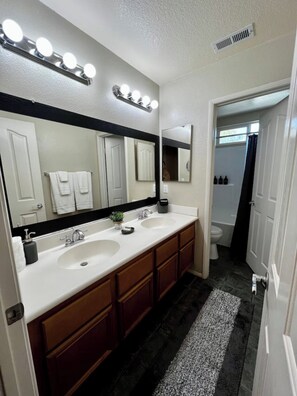 Shower, jetted tub, hair dryer, towels