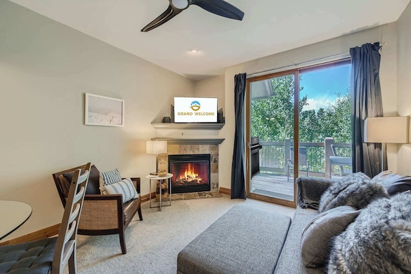 Curl up in the living room by the fireplace & enjoy a movie night at home
