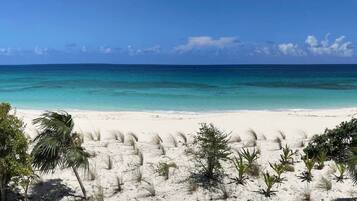 On the beach, sun loungers, beach towels