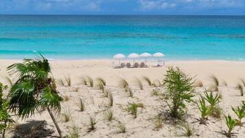 On the beach, sun loungers, beach towels