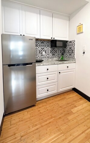 Microwave, stovetop, coffee/tea maker, electric kettle