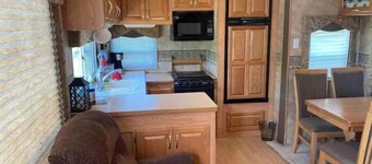 Lake shore queen bed trailer, tiki torches, & tent space for extra guest