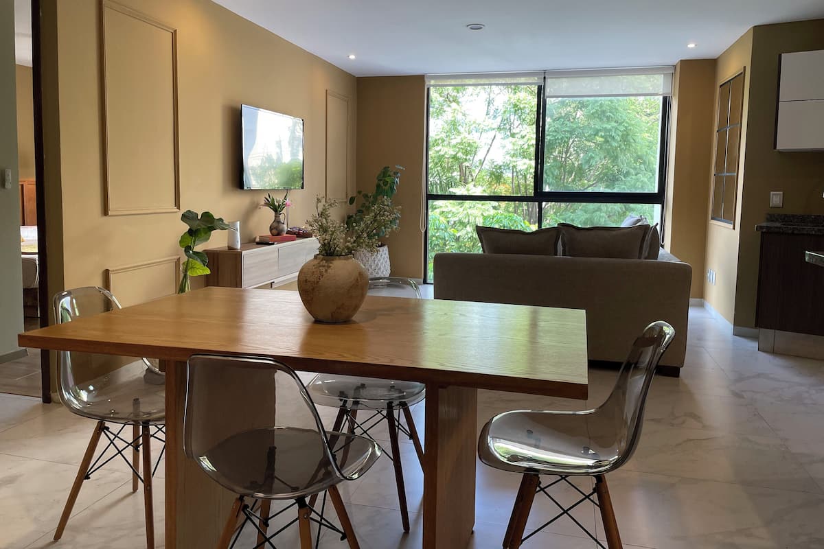 Comfort Apartment | Living area | 60-inch Smart TV with digital channels, Netflix, Hulu