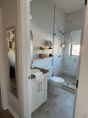 Shower, hair dryer, towels, soap