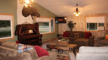 Smart TV, fireplace, foosball, books