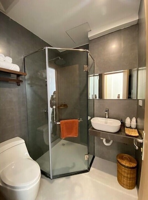 Shower, hair dryer, towels, soap