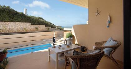 Apartment 'Praia Areia Branca' with Sea View, Shared Pool and Wi-Fi