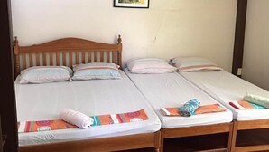 A room with two beds, a ceiling fan, an air conditioning unit, and a framed picture on the wall. - Princesa El Gallo Inn (Puerto Princesa)