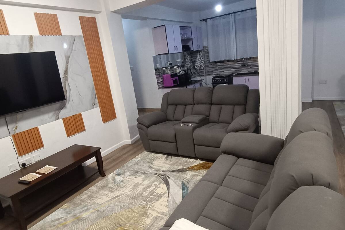 Standard Apartment | Living area | 40-inch TV with digital channels