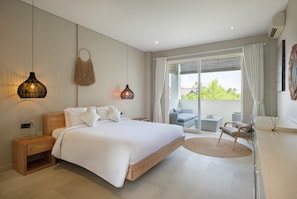 A modern bedroom with a large bed, bedside tables, a hanging light fixture, and a view of the outdoors. - Villa Levi by GORO (Seminyak)