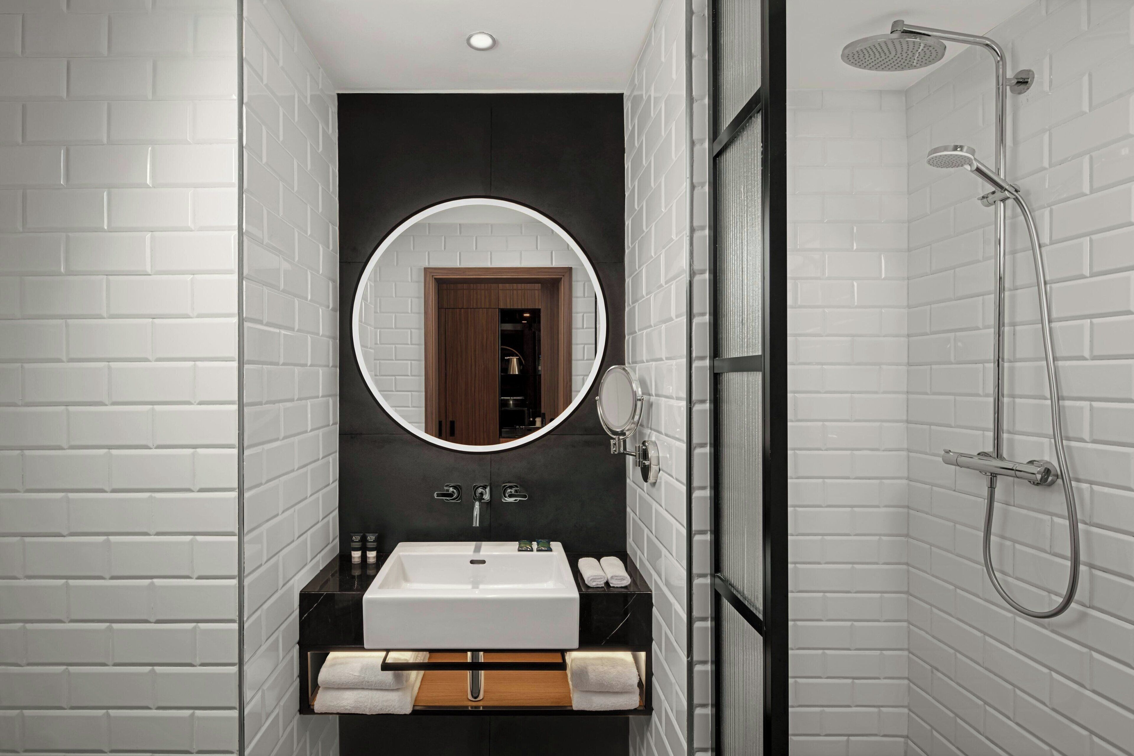 Eco-friendly toiletries, hair dryer, slippers, towels