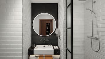 Eco-friendly toiletries, hair dryer, slippers, towels