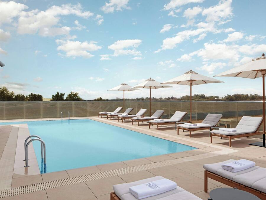 Outdoor pool, open 10:00 AM to 8:00 PM, pool umbrellas, sun loungers