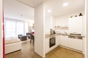 Fridge, stovetop, dishwasher, coffee/tea maker