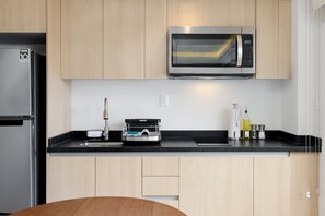 Fridge, microwave, stovetop, coffee/tea maker