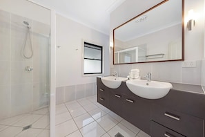 Shower, hair dryer, towels, shampoo