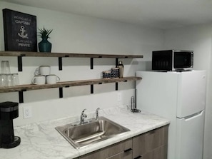 Fridge, microwave, coffee/tea maker, toaster