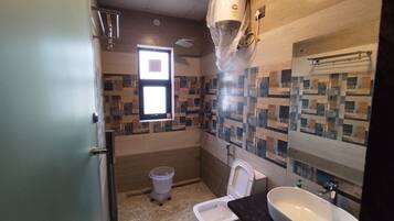 Shower, rainfall showerhead, towels, soap