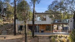 A modern two-story house with a patio, outdoor seating, and a barbecue area. - Bimbadeen Bliss (Fairhaven)