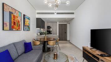 Deluxe Apartment, Balcony, City View | Living area | Flat-screen TV