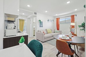 Enjoy a compact yet functional stay with a kitchenette, dining area, and living space, plus a small balcony with a view.