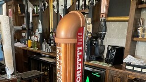 A bar area with a copper tap labeled "BIRRA MORETTI," a Heineken refrigerator, and a Pepsi vending machine. - Holystone Bar and Restaurant  (Newcastle-upon-Tyne)