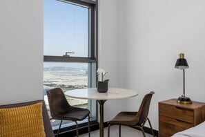 Deluxe Studio, Balcony, City View | Dining room - Waves - Stylish 13th-Floor Studio with Top-Notch Amenities (Dubai)