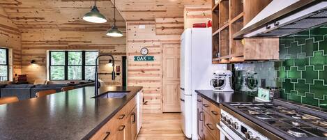 Fridge, stovetop, dishwasher, coffee/tea maker