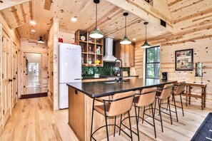 Fridge, stovetop, dishwasher, coffee/tea maker