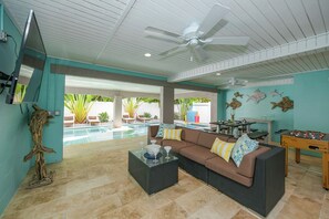 TV, table football, offices - Family Getaway at A Change in Latitude: Private Pool, Games, 5 Mins to Beach! (Anna Maria)