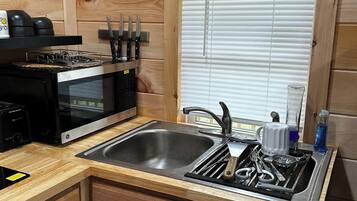 Fridge, microwave, stovetop, coffee/tea maker