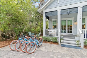 A building with a porch, steps, and a number '119' on the wall. - Close to Seaside ~ Fully Stocked Kitchen ~ Golf Cart ~ Two Community Pools (Santa Rosa Beach)