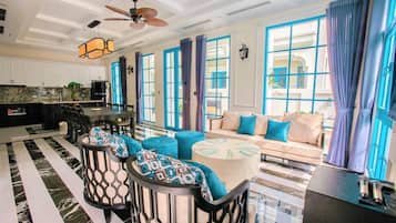 Junior Villa | Living area | 18-inch flat-screen TV with cable channels