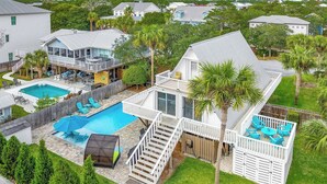 A residential property with a large backyard featuring a swimming pool, a covered patio, and a deck. - Mermaid’s Retreat - Heated Private Pool, Walk to Beach, Complimentary Bikes! (Santa Rosa Beach)