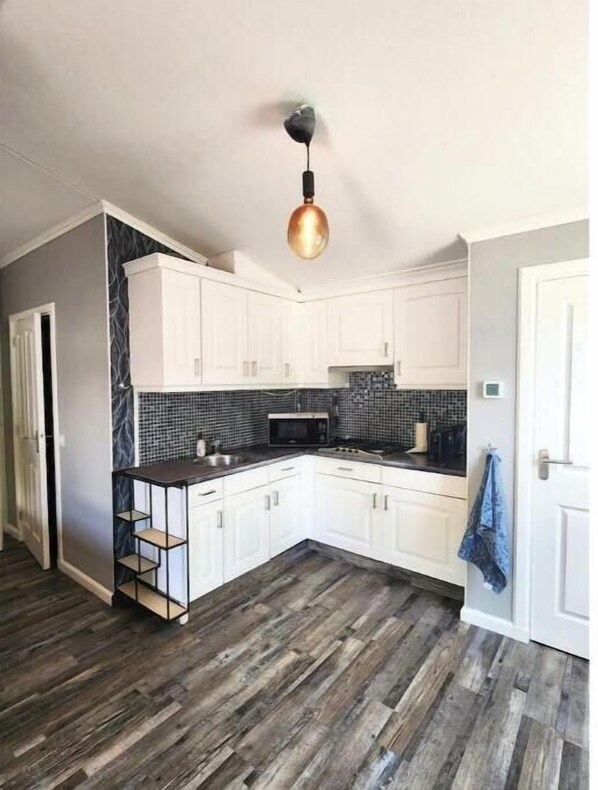 Fridge, microwave, oven, dining tables