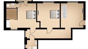 Een plattegrond van een hotelkamer met een badkamer, slaapkamer en een zithoek.